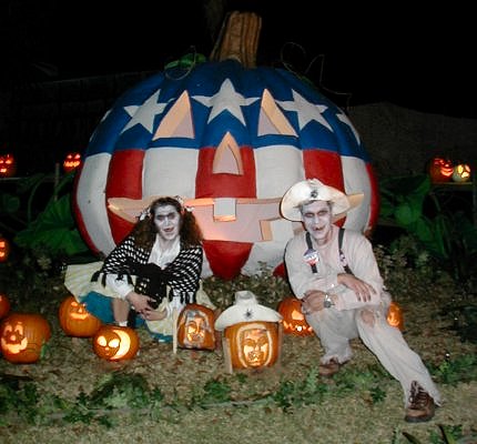 Pappy & Polly pose with pumpkin portraits