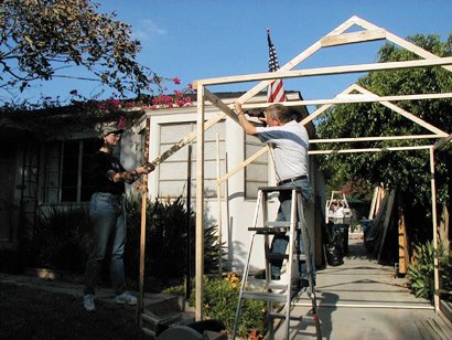 Sue and Wayne frame the greenhouse